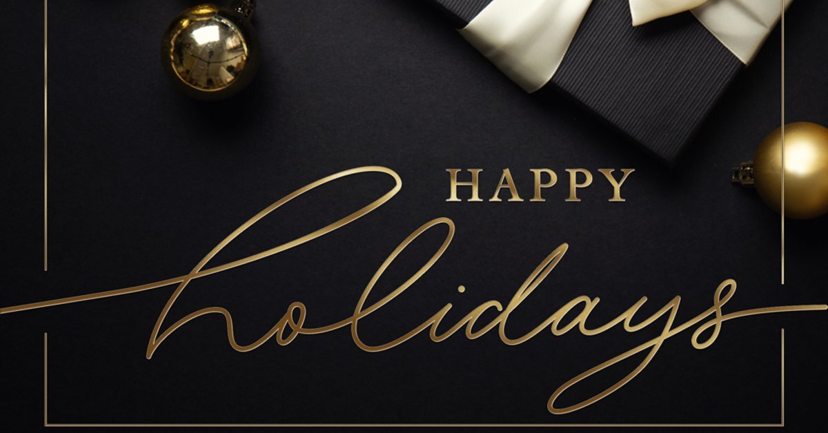 Elegant holiday greeting card with gold script typography, decorative ornaments, and gift wrapping on a sophisticated dark background.